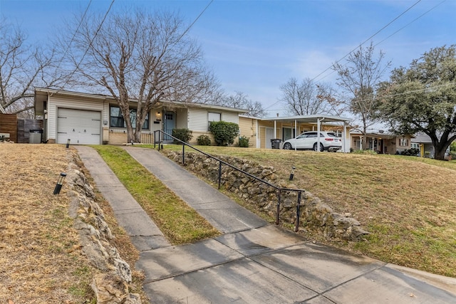 ranch-style home with a carport, a garage, and a front yard