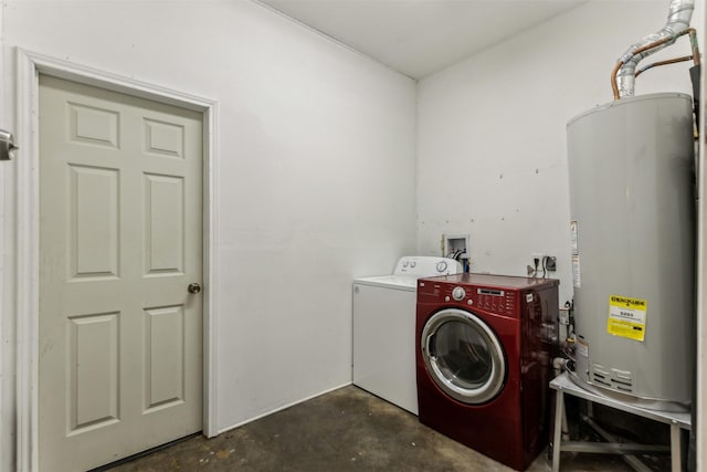 laundry area featuring laundry area, water heater, and separate washer and dryer