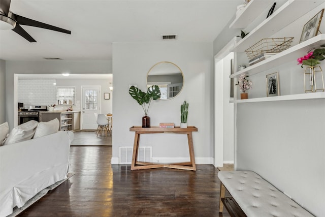 interior space featuring visible vents and dark wood finished floors