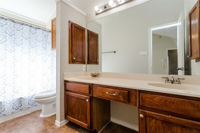 bathroom featuring tile patterned floors, vanity, and toilet