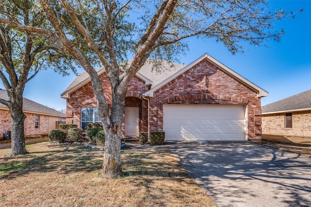 view of front property with a garage and a front lawn