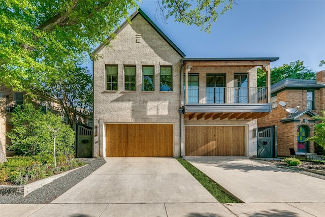 view of front of house featuring a garage and a balcony