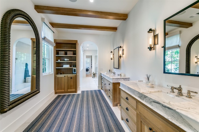 bathroom with vanity and beamed ceiling