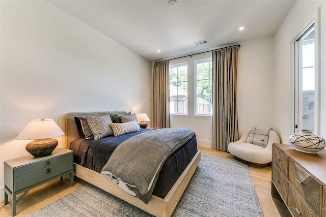 bedroom with light hardwood / wood-style flooring