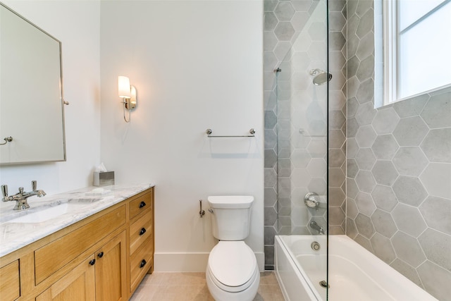 full bathroom with vanity, tile patterned flooring, toilet, and tiled shower / bath