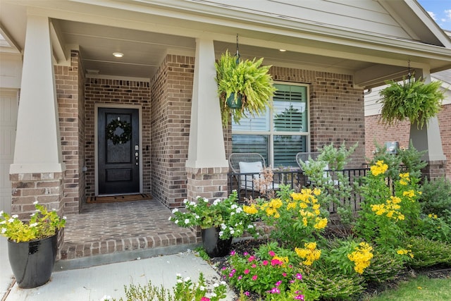 doorway to property with covered porch