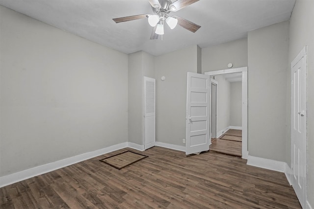 unfurnished bedroom with dark hardwood / wood-style floors and ceiling fan