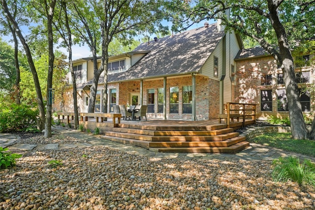 back of property featuring a deck