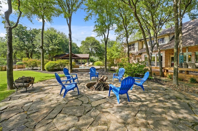 exterior space featuring an outdoor fire pit