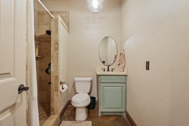 bathroom with toilet, vanity, and a shower with shower curtain