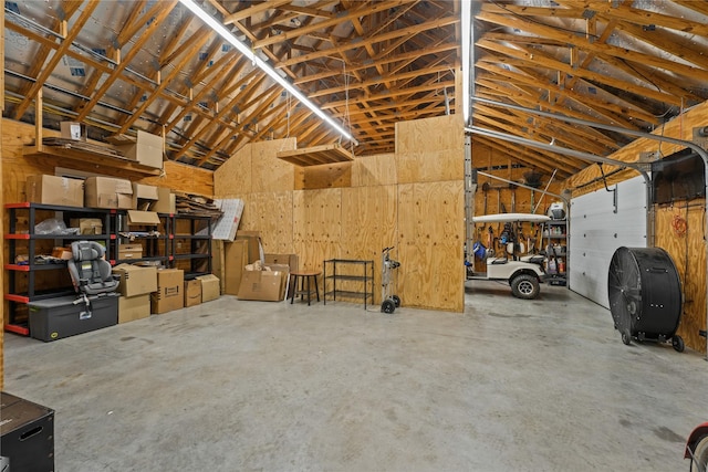 garage featuring wood walls