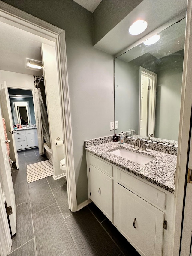 bathroom with vanity and toilet