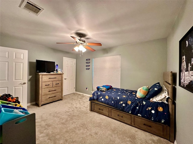 bedroom featuring ceiling fan and carpet