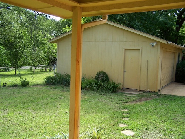 view of outbuilding with an outbuilding and fence