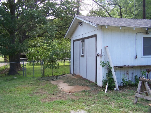 view of shed with a gate and fence