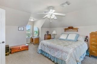 carpeted bedroom featuring ceiling fan and vaulted ceiling