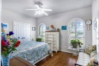 bedroom with dark hardwood / wood-style flooring