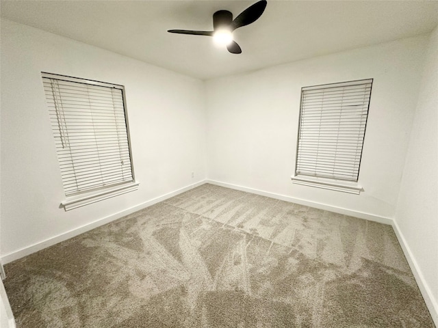 unfurnished room with carpet floors and ceiling fan