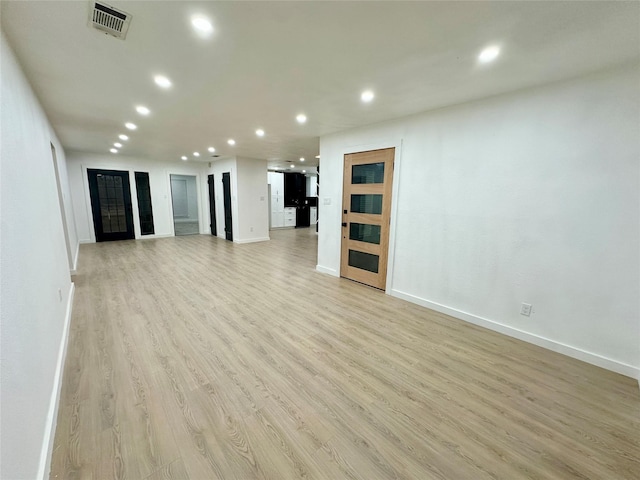 unfurnished living room featuring light wood-type flooring