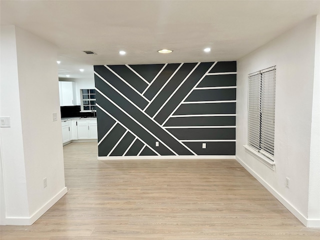 interior space with sink and light hardwood / wood-style floors