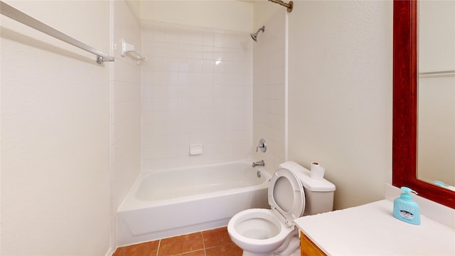 full bathroom with vanity, tile patterned flooring, tiled shower / bath combo, and toilet