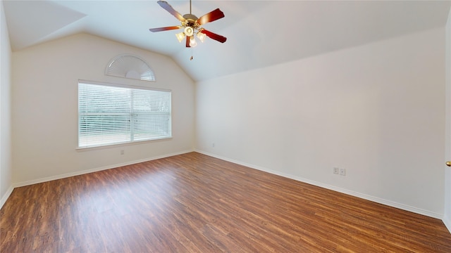 empty room featuring lofted ceiling, dark hardwood / wood-style floors, and ceiling fan