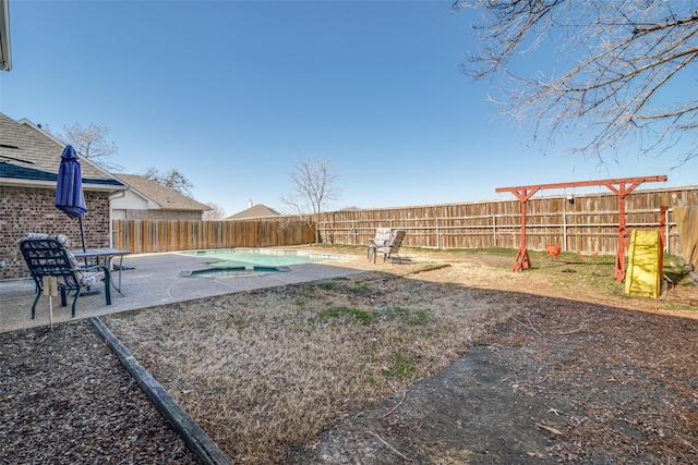 view of yard featuring a patio and a covered pool