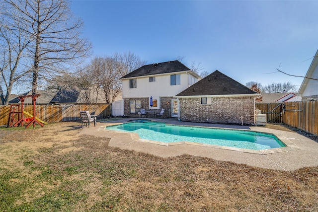 view of pool featuring a lawn