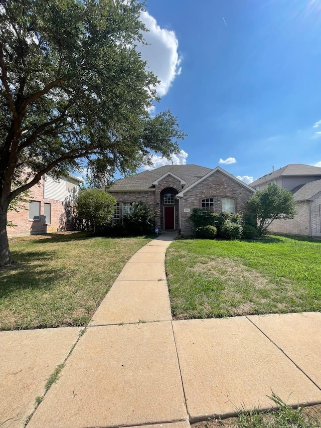 view of front of home with a front yard