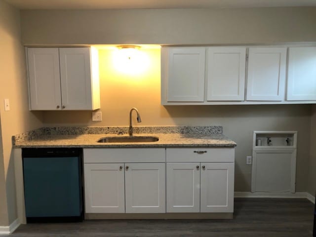 kitchen featuring white cabinetry, stainless steel dishwasher, and sink