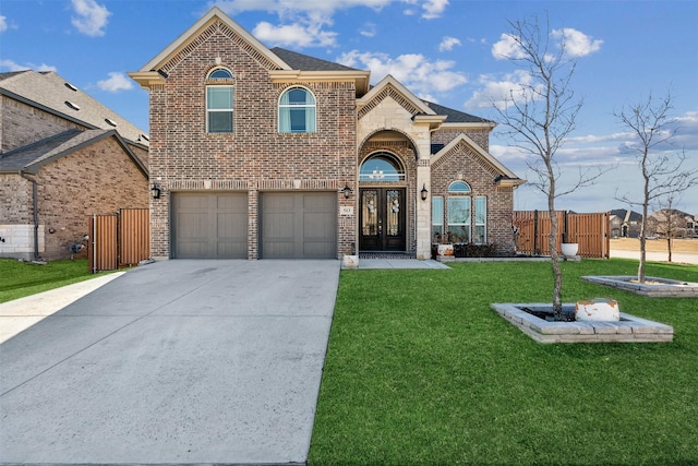 front of property featuring french doors, a garage, and a front lawn