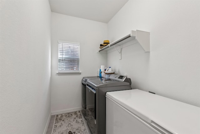 laundry room with separate washer and dryer