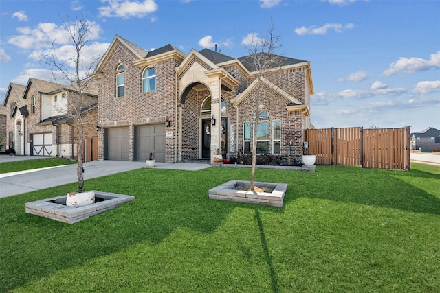 view of property with a garage and a front lawn