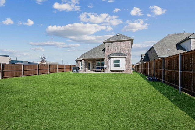 rear view of house featuring a patio and a lawn