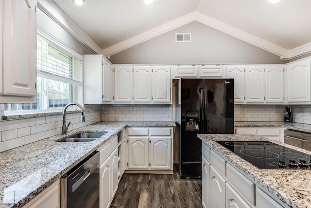 kitchen featuring lofted ceiling, sink, ornamental molding, black appliances, and white cabinets