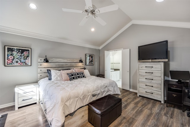 bedroom featuring dark wood-type flooring, vaulted ceiling, ceiling fan, and ensuite bathroom