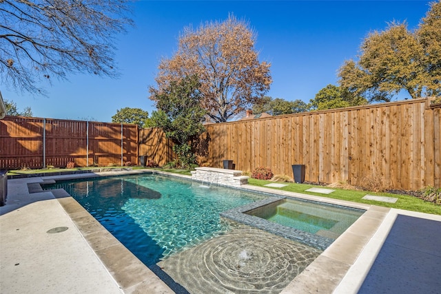 view of pool with an in ground hot tub