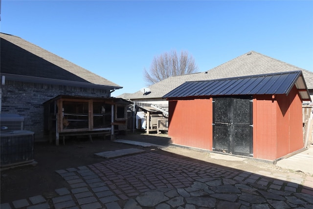 exterior space with a shed