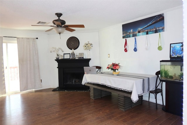 dining space featuring ornamental molding, dark hardwood / wood-style floors, and ceiling fan