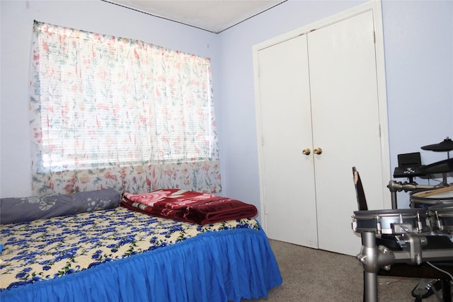 bedroom featuring a closet and carpet