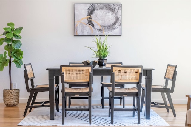 dining area with light wood-type flooring