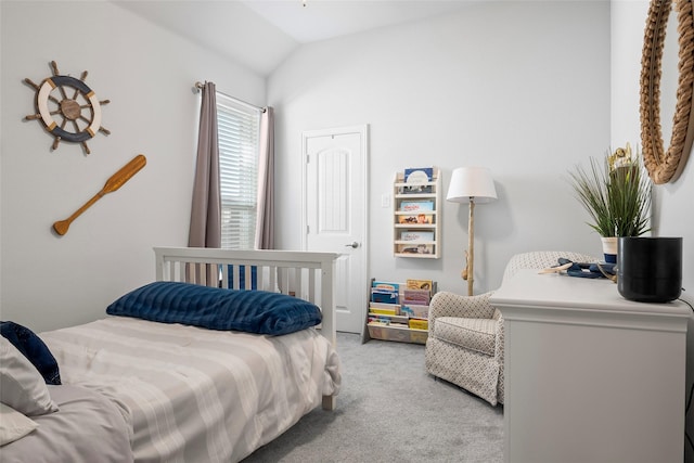 bedroom with vaulted ceiling and carpet