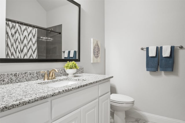 bathroom featuring vanity, toilet, and a shower with shower curtain