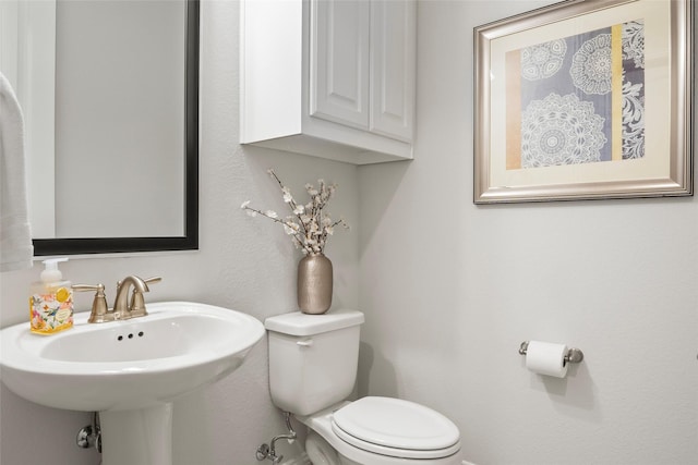 bathroom with sink and toilet