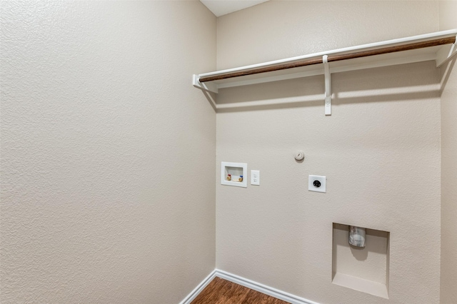 clothes washing area featuring washer hookup, hardwood / wood-style floors, hookup for a gas dryer, and electric dryer hookup