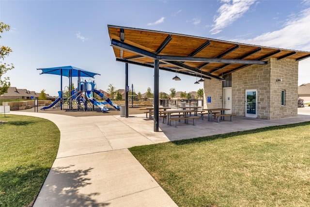 view of community featuring a yard and a playground