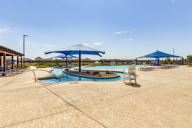 view of pool featuring a gazebo, a water view, and a patio