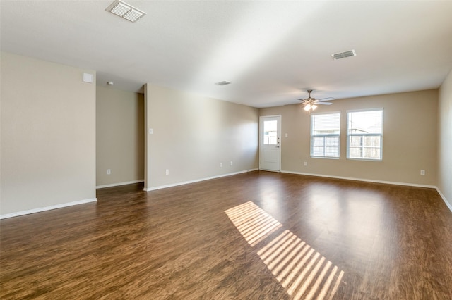 unfurnished room featuring dark hardwood / wood-style floors and ceiling fan