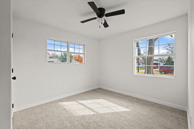 unfurnished room featuring carpet and ceiling fan