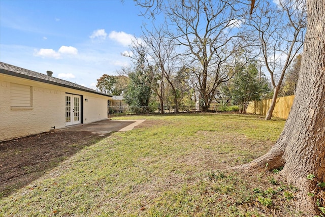 view of yard featuring french doors